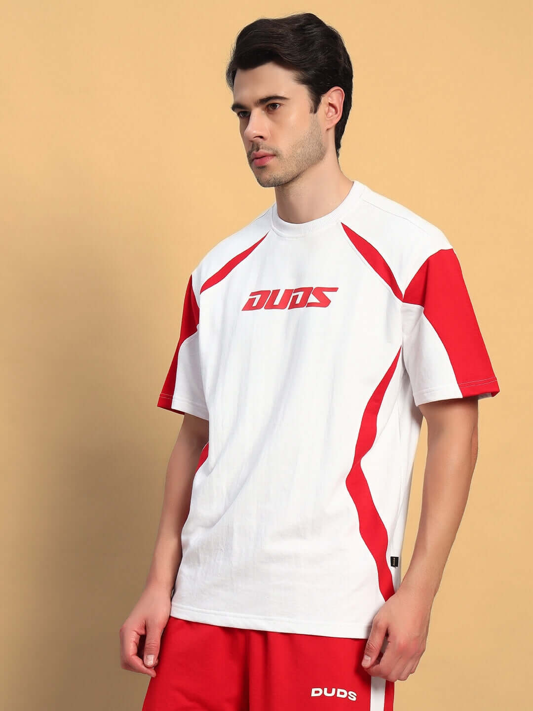 Model wearing Candor oversized white and red t-shirt