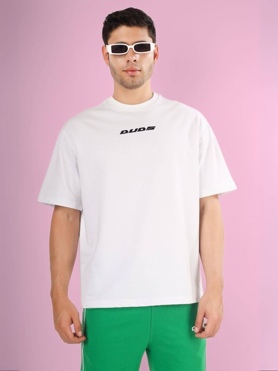 Model wearing DONT STOP OVER-SIZED T-SHIRT WHITE, featuring premium heavy gauge fabric, 97% cotton, 3% elastane, stylish casual wear.