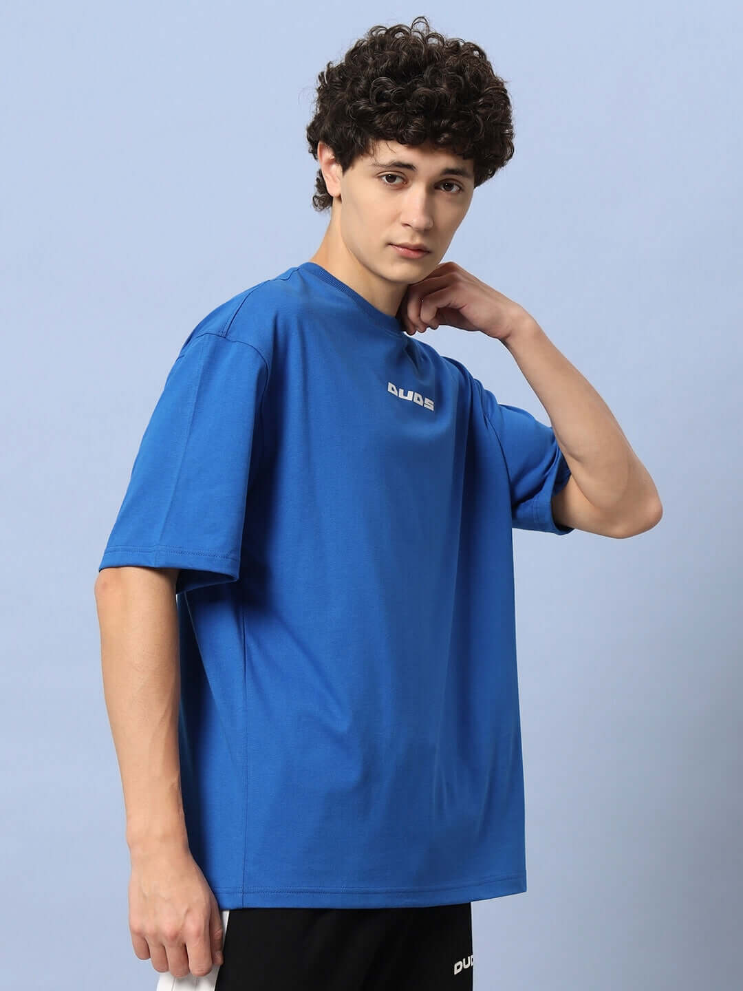Model wearing LUNA OVER-SIZED T-SHIRT ROYAL BLUE, showcasing relaxed fit and vibrant color.