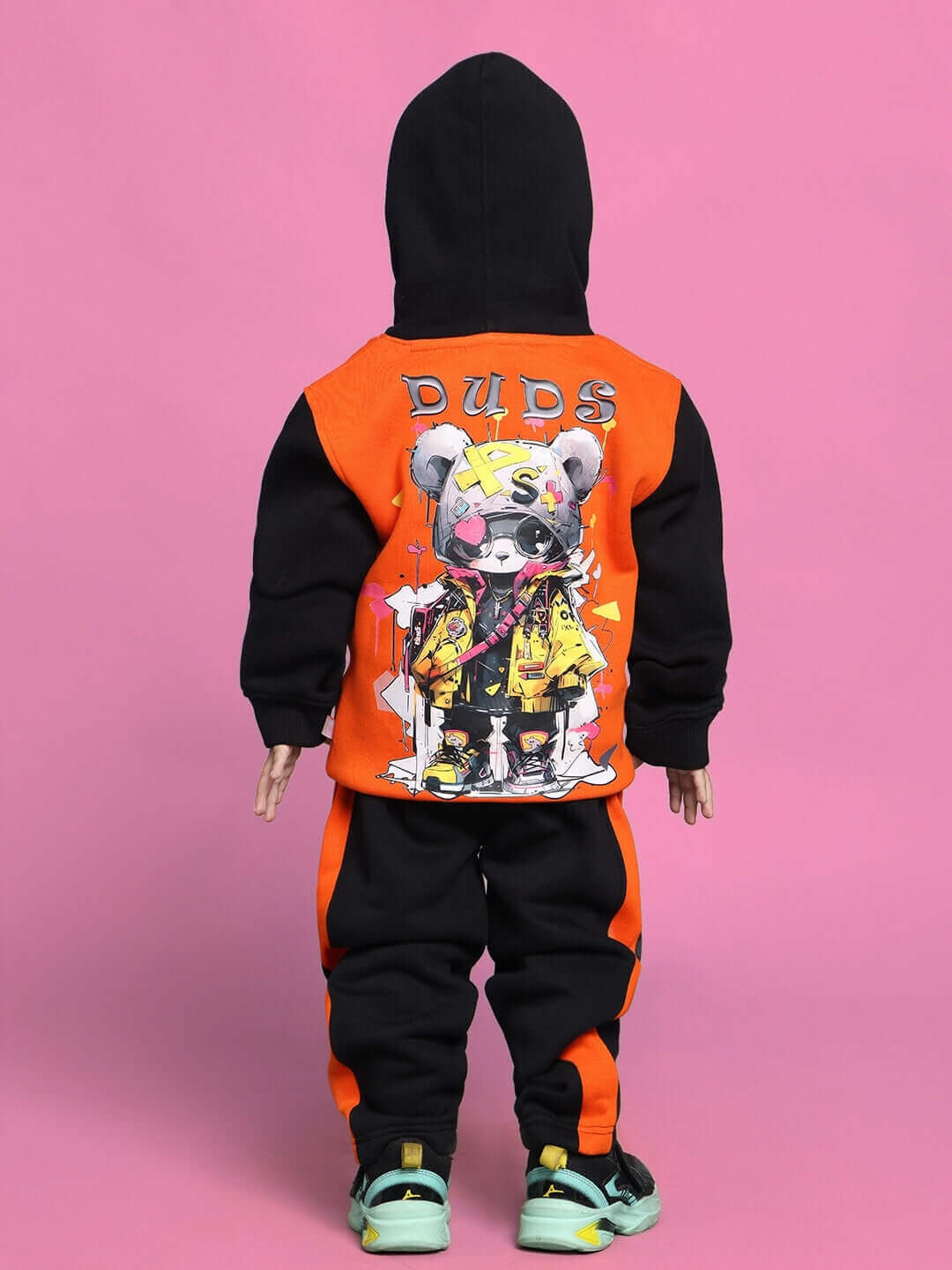Cool teddy co-ord outfit for boys and girls in black and orange, featuring a teddy graphic on the back, ideal for stylish kids.