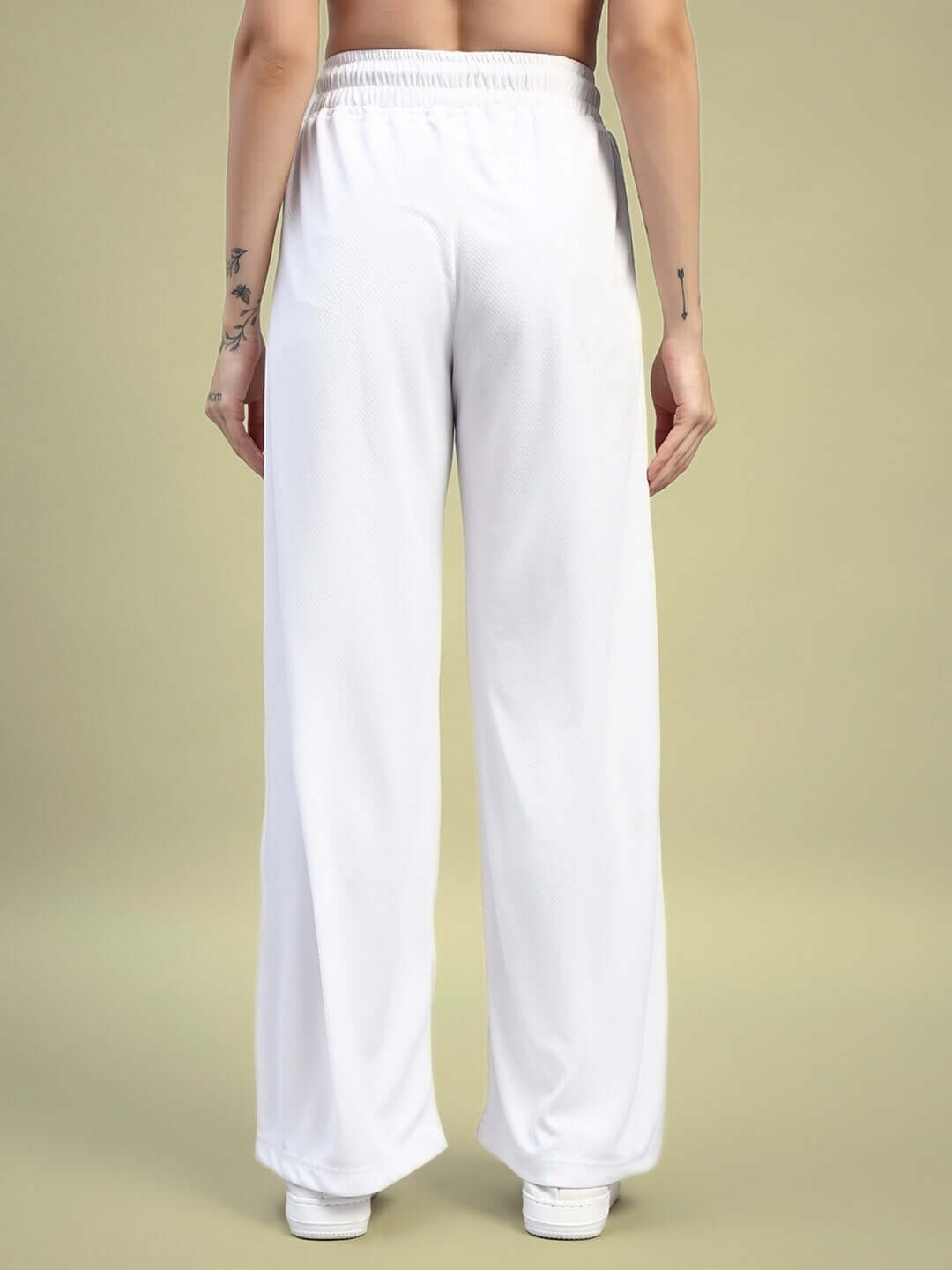 Back view of women's white unisex cubby co-ord set joggers with elasticated waistband, relaxed fit, premium sports polyester fabric.
