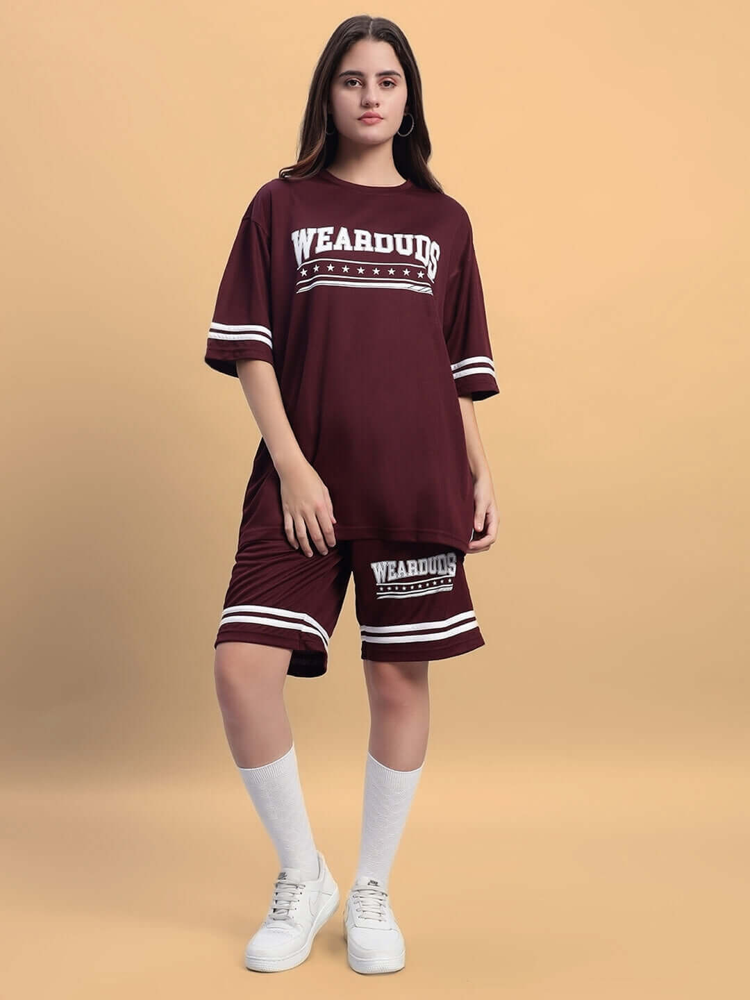 Women's wine colorblock co-ord set in sports polyester fabric, featuring a relaxed fit with shorts and matching shirt.