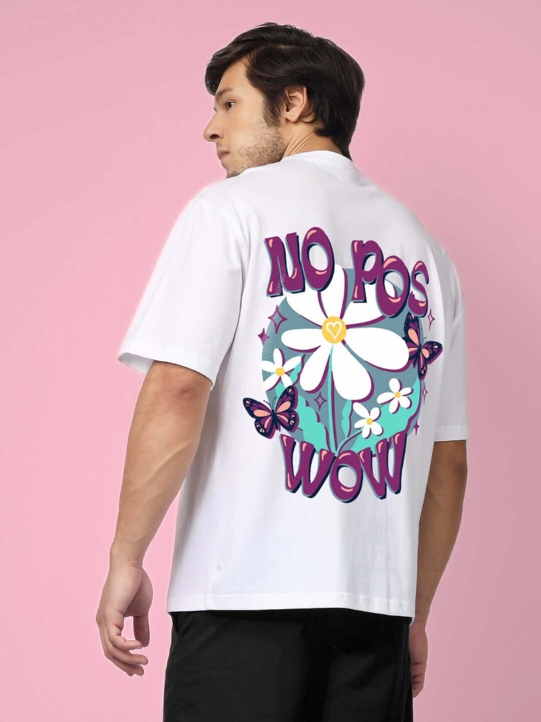 Model wearing white NO POS WOW oversized t-shirt with vibrant print and floral design, offering custom fit option for prepaid orders.