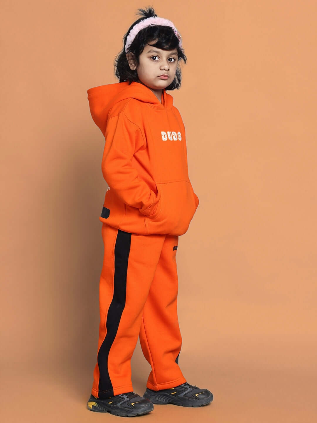 Orange Courage Fleece Pant for Boys and Girls shown being worn, showcasing comfort and style.