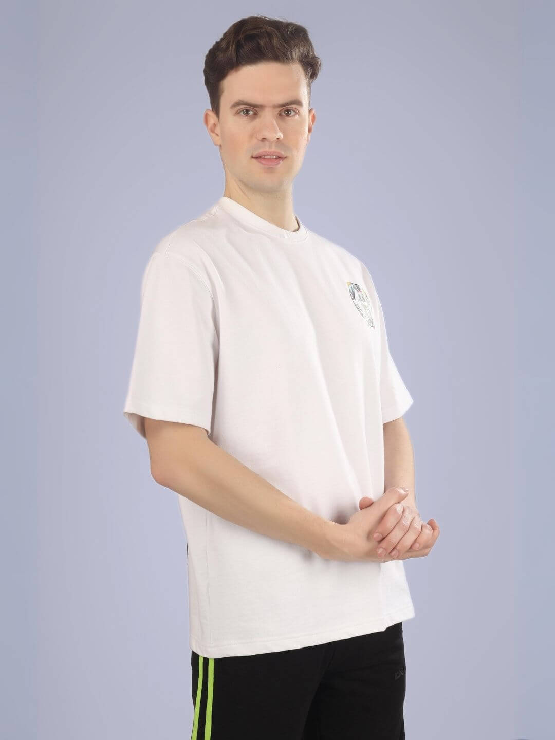 Model wearing A Doll Not Rabbit oversized white printed t-shirt, crafted from 100% cotton for comfort and relaxed fit.