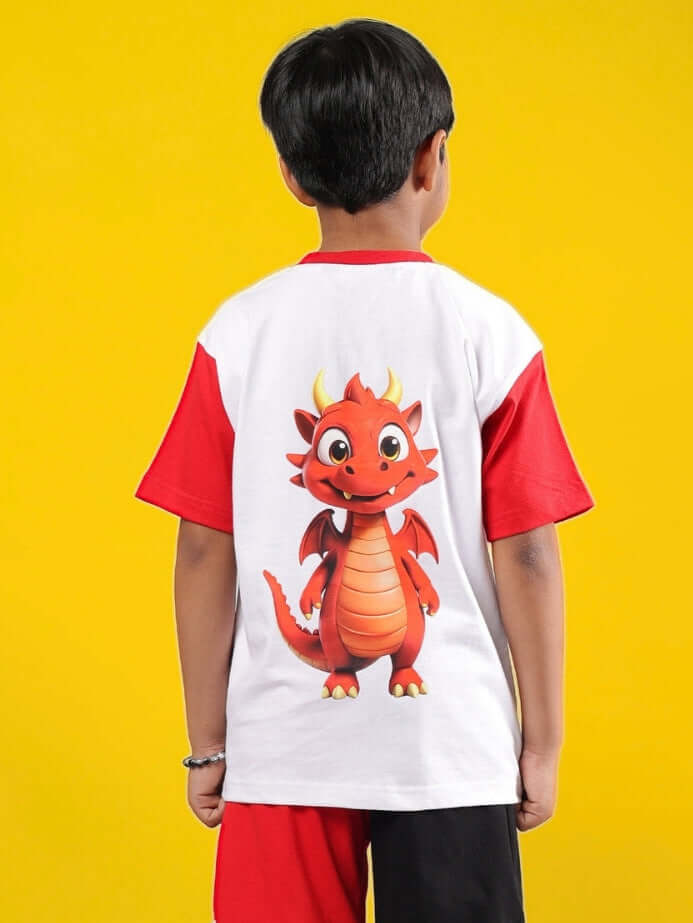 Boy wearing Cassie T-shirt in white-red with dragon print, standing against yellow background. Unisex kids' T-shirt for boys and girls.