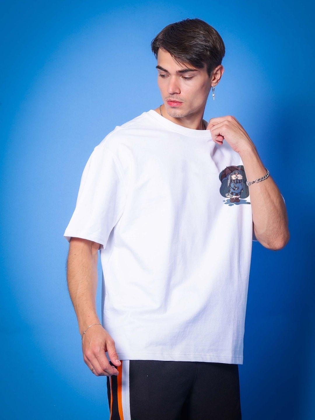 Model wearing BLUE LAPIN OVER-SIZED T-SHIRT WHITE made of premium cotton French terry in white color.