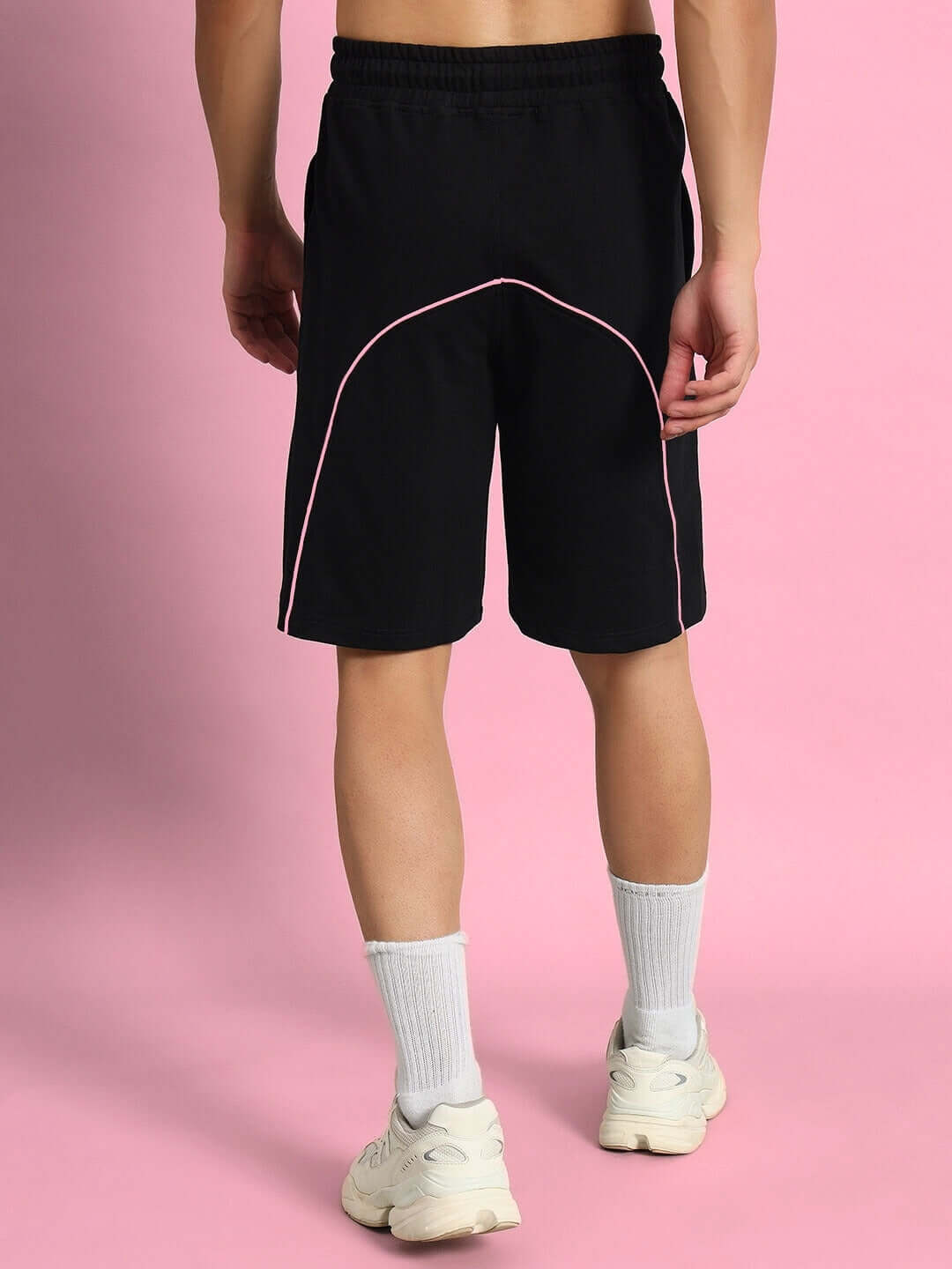 Back view of GLARE regular fit black shorts with pink accents, showcasing style and comfort for custom or standard fit options.