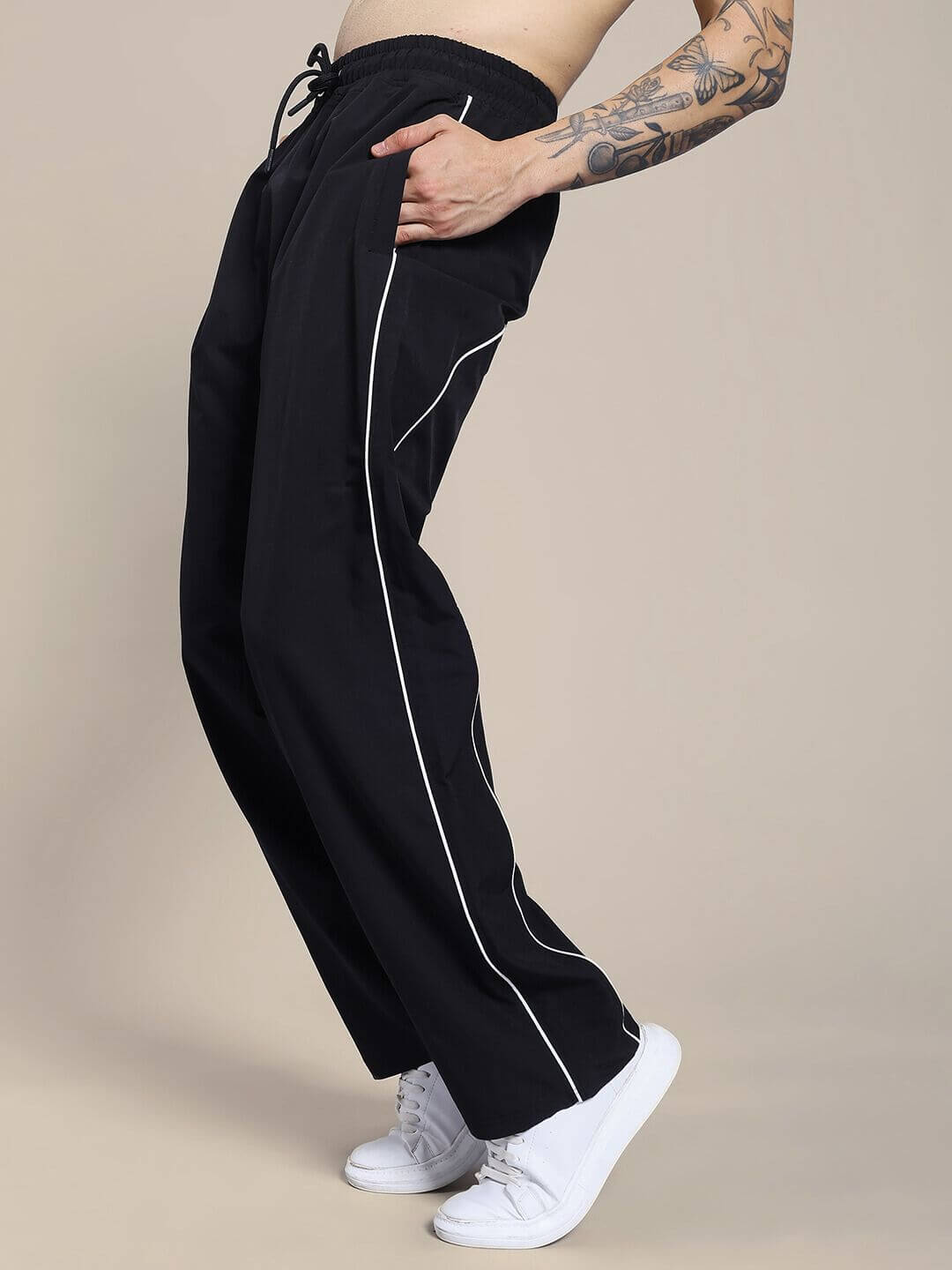Stylish TURBO TRACK RELAXED-FIT JOGGERS BLACK showcasing streetwear comfort with a relaxed silhouette and modern design details.