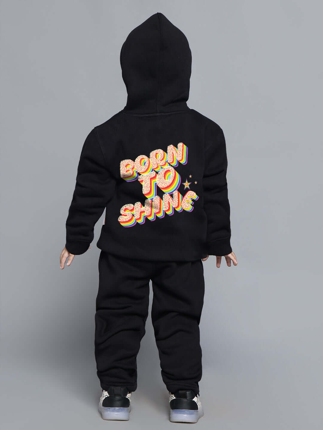 Child wearing "Born to Shine" black co-ord set with colorful text on hoodie, suitable for boys and girls.
