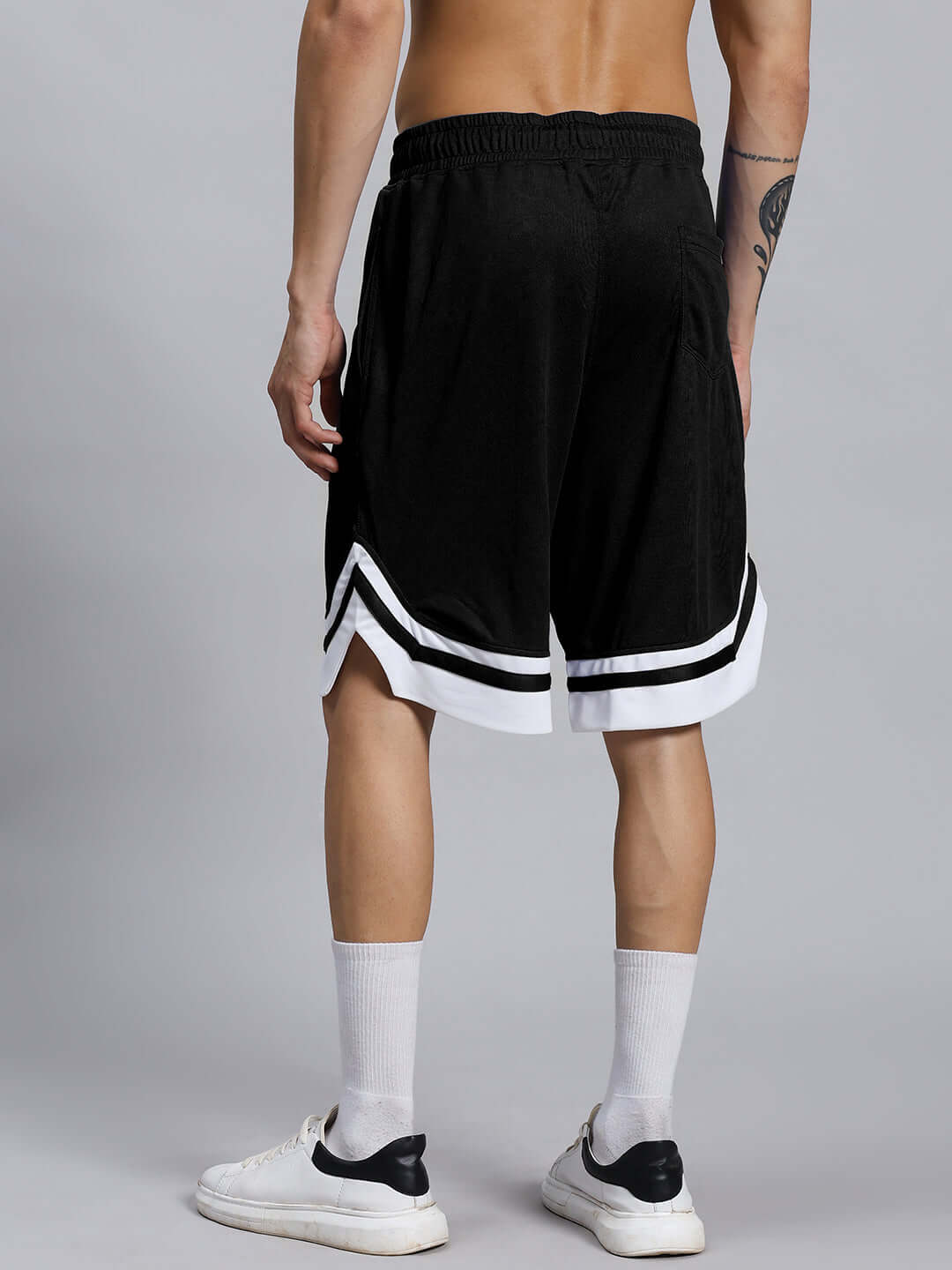 Back view of FLEX GYM CO-ORD SET (BLACK) featuring sports polyester shorts with white stripe detail, ideal for workouts and leisure.