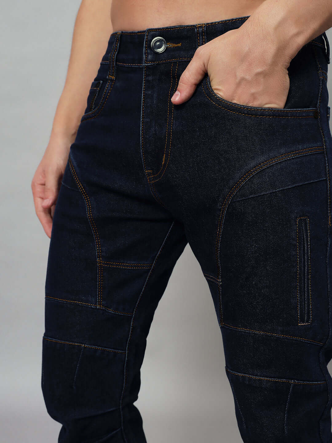 Close-up of NOVICE Contrast Stitch Denim Jeans in blue, showcasing detailed stitching and fit by DUDS, available in custom sizes.