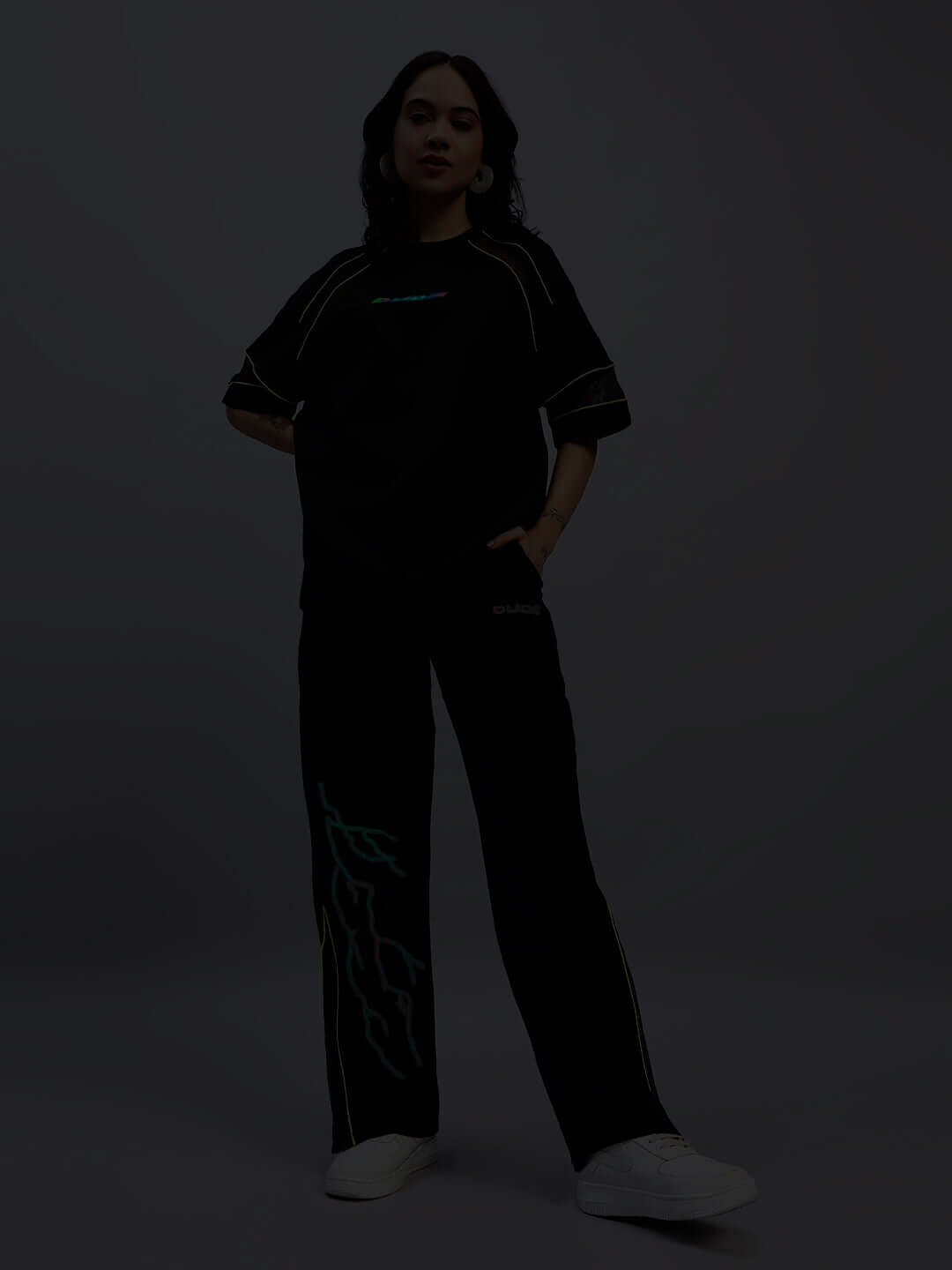 Women's black sports co-ord set with reflective design, made of premium polyester. Comfortable, stylish, perfect for active wear.