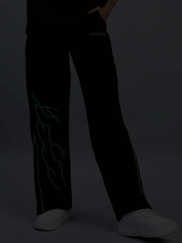 Women's black relaxed-fit joggers with reflective design, part of the Salvo Reflector collection, customizable for a perfect fit.