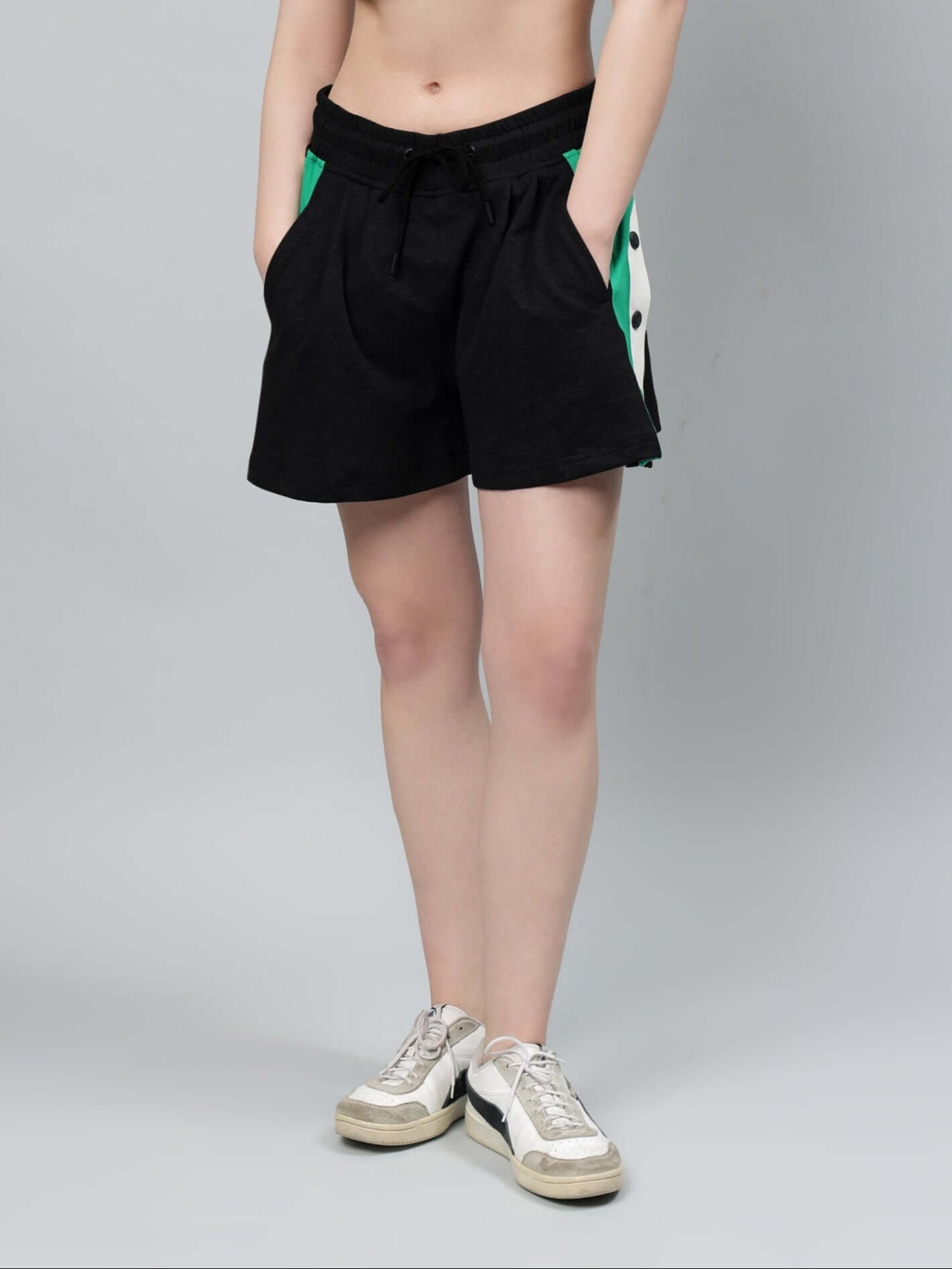 Front view of Women's Sammie Shorts in black with a relaxed fit, worn by a model. Custom fit available in prepaid orders.
