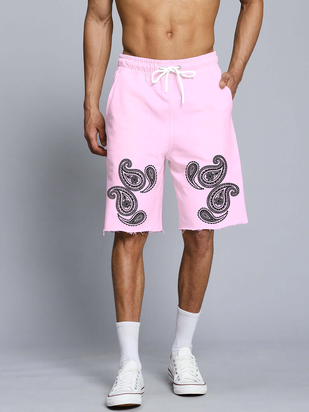 Model wearing pink paisley print co-ord set shorts made from premium cotton French terry, featuring elastic waistband and side pockets.