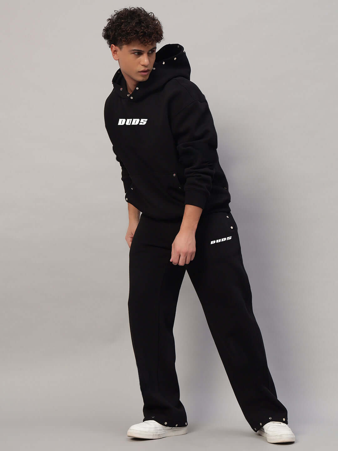 Person wearing WEARDUDS RIGID FLEECE HOODIE BLACK, showcasing stylish and comfortable design.