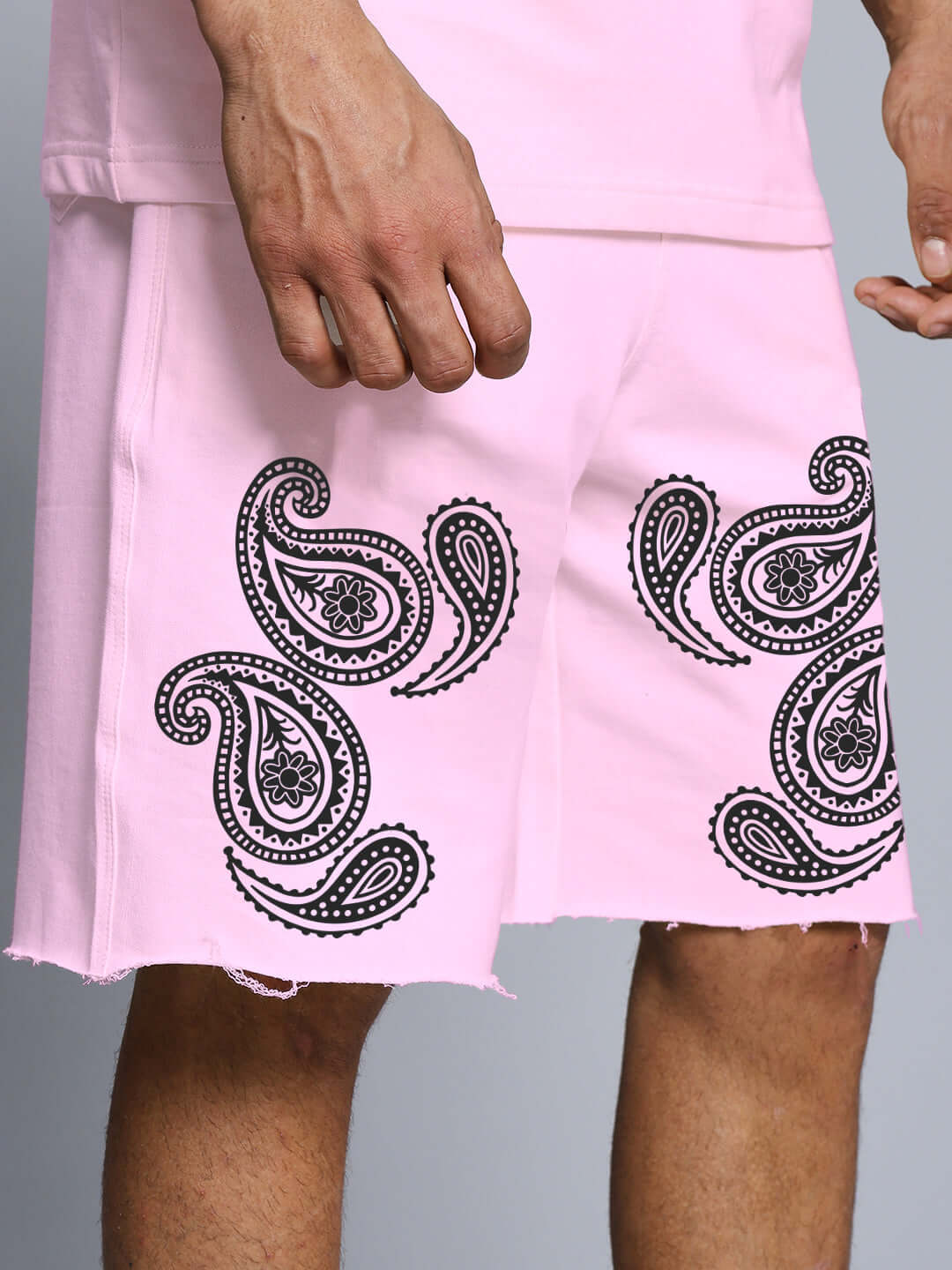 Messi paisley print pink co-ord shorts in heavy cotton terry, featuring intricate black paisley patterns, designed for comfort and style.