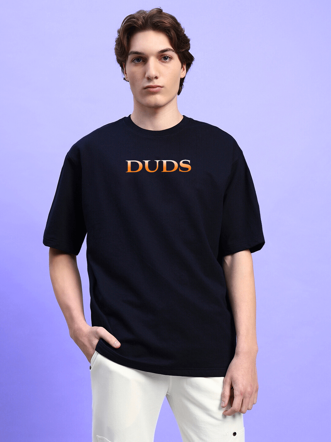 HIDDEN POWER PRINTED OVERSIZED T-SHIRT BLACK worn by model against a purple background, showcasing relaxed fit and bold design.