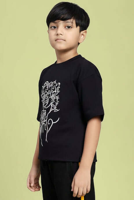 Boy wearing LIFFY GEAR PRINTED T-SHIRT FOR BOYS AND GIRLS BLACK with graphic print, stylish and comfortable for kids.