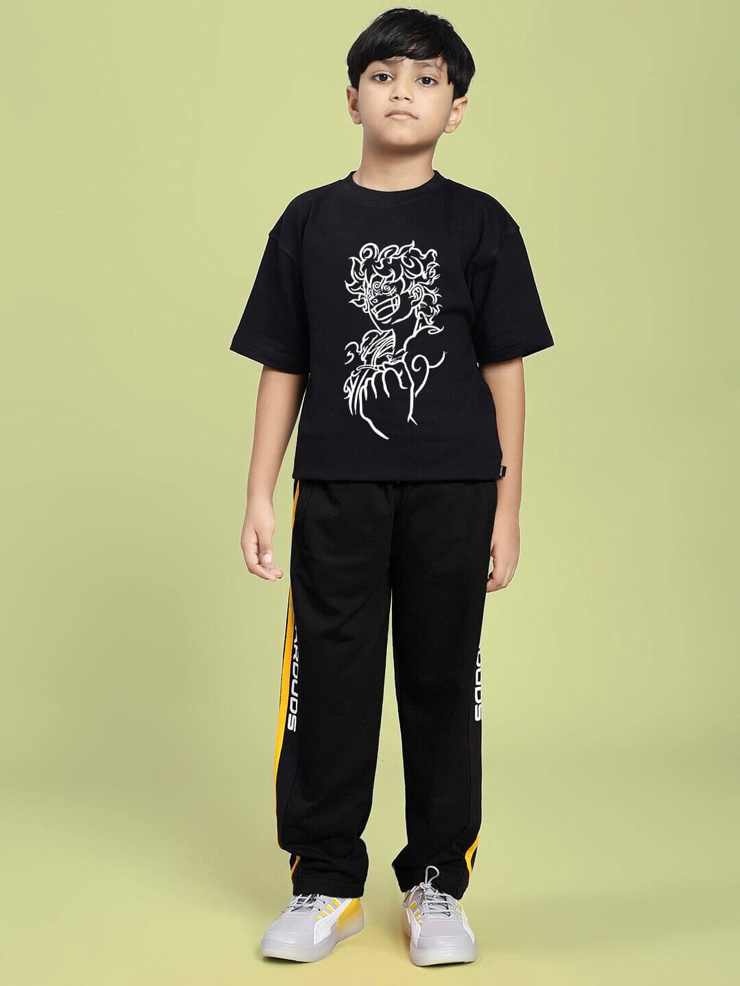 LIFFY GEAR PRINTED T-SHIRT FOR BOYS AND GIRLS BLACK with graphic print design, worn by a boy standing against a green background.