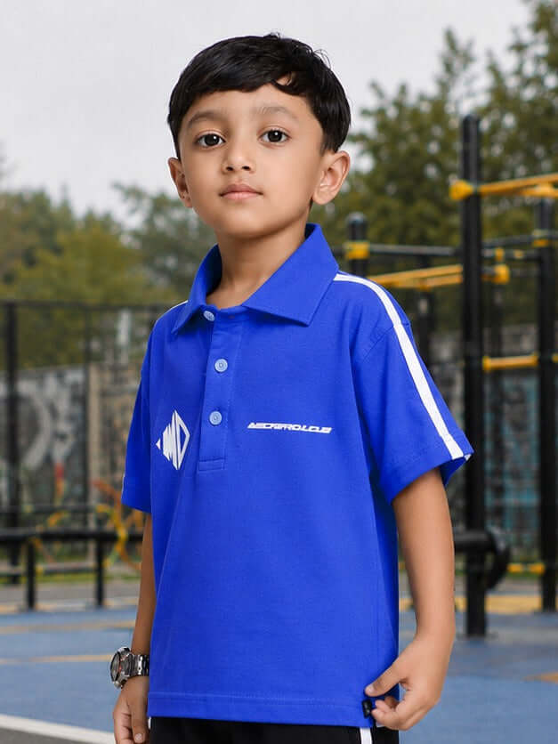 CHAMPION TRACK POLO T-SHIRT FOR BOYS GIRLS BLUE worn by a boy in a playground setting.