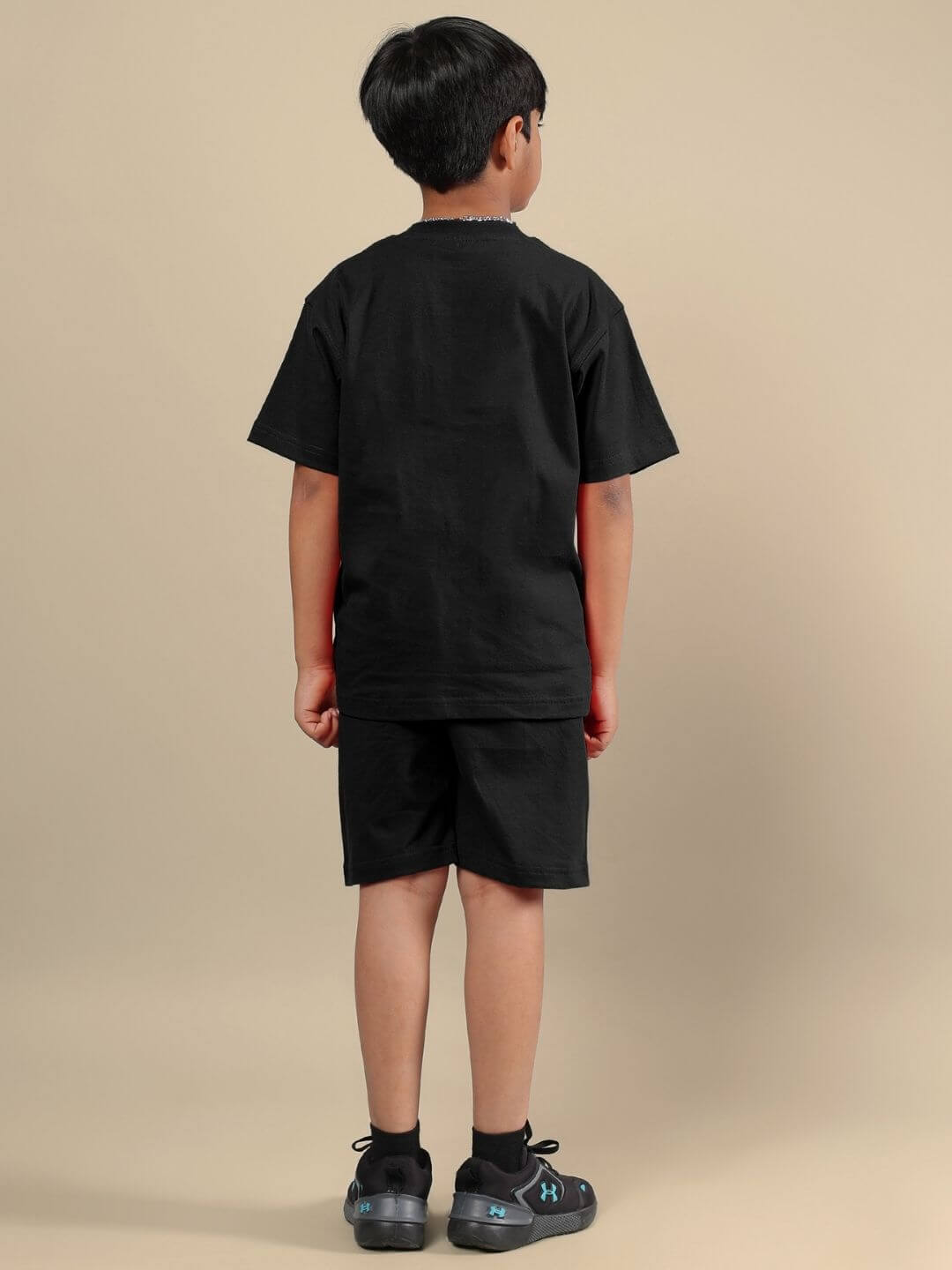 Child wearing ACE CO-ORD FOR BOYS AND GIRLS BLACK, showcasing the stylish and comfortable matching set for everyday kids' fashion.