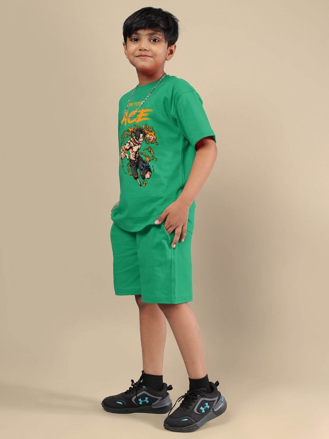 Boy wearing ACE CO-ORD FOR BOYS AND GIRLS GREEN, showcasing stylish green matching set with graphic tee and shorts for kids.