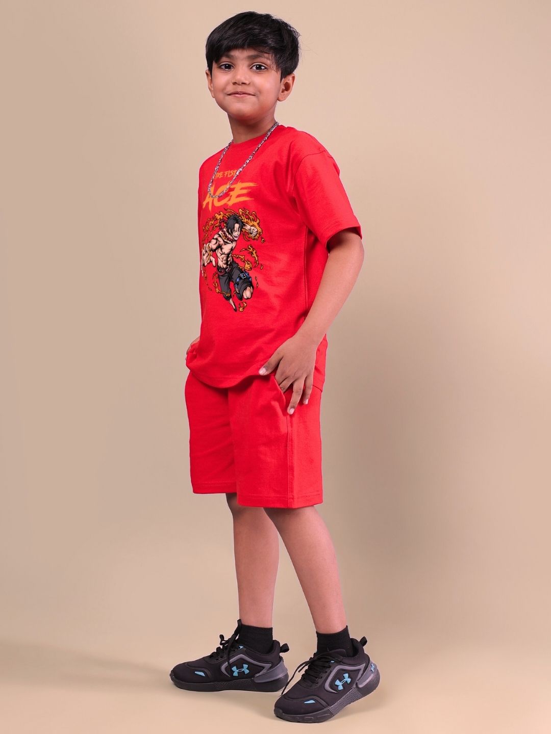 Boy wearing ACE co-ord set in bold red, standing confidently, showcasing stylish and comfortable kids' clothing for boys and girls.