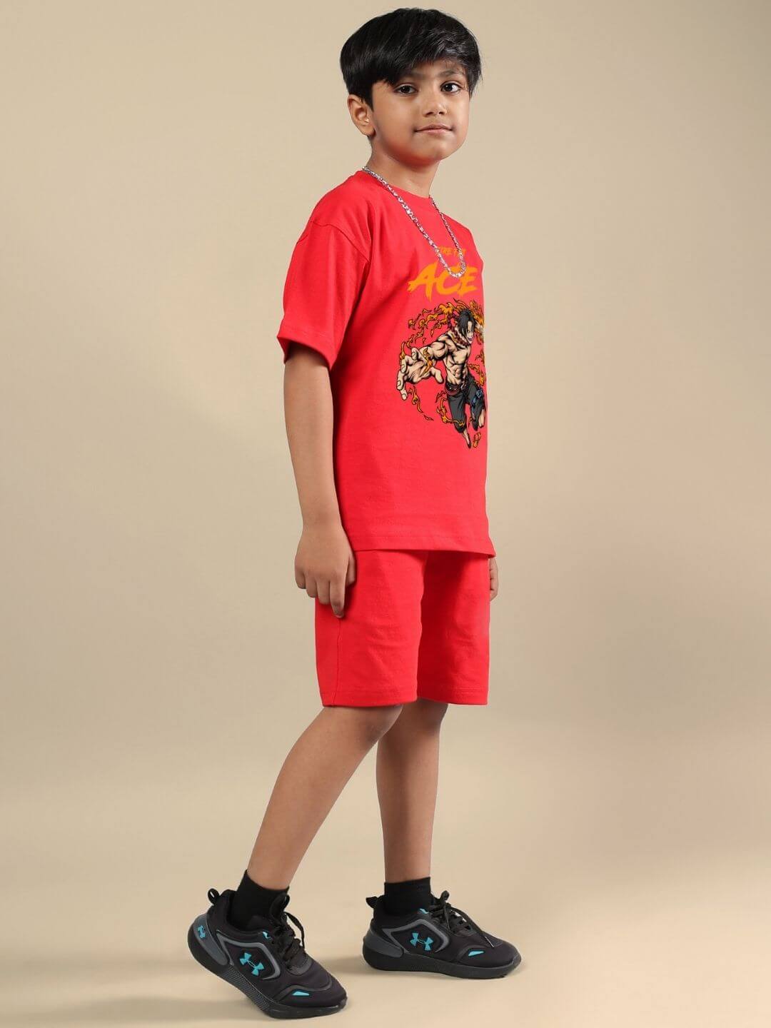 Boy wearing ACE red co-ord set for kids, featuring a bold graphic t-shirt and matching shorts, combines vibrant style and comfort.