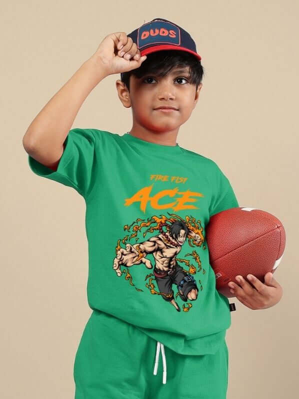 Young boy wearing ACE green t-shirt with graphic design, holding a football, ideal unisex clothing for active kids.