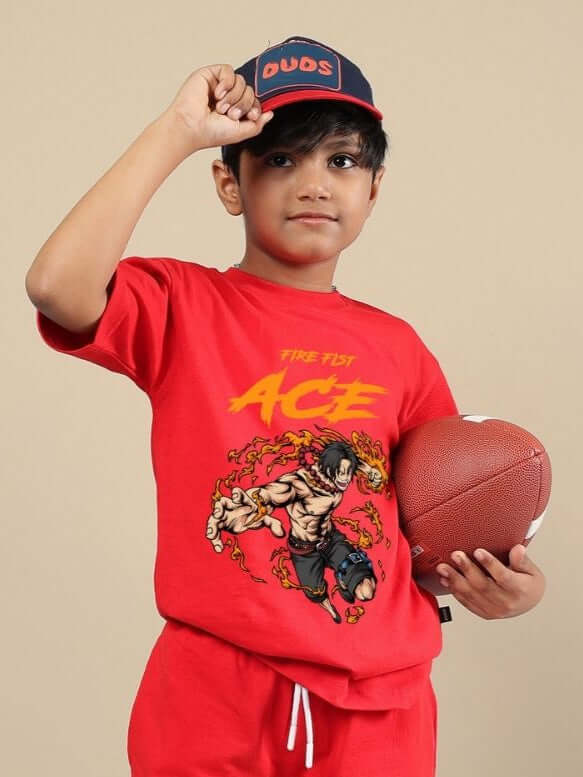 Child wearing ACE T-shirt for boys and girls in red, holding a football, showcasing vibrant unisex design with bold graphic.
