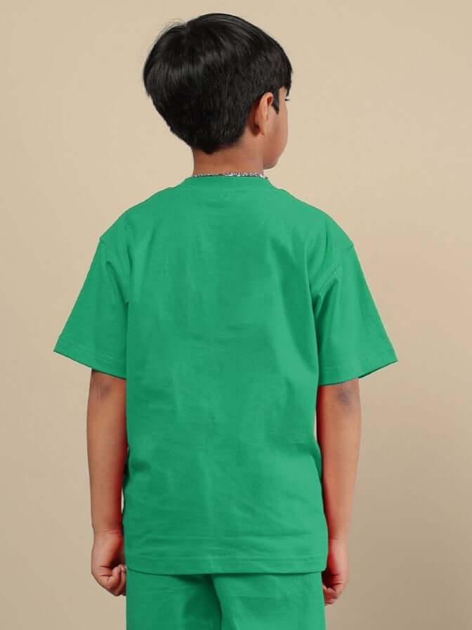 Boy wearing ACE T-SHIRT FOR BOYS AND GIRLS GREEN, showcasing back view.