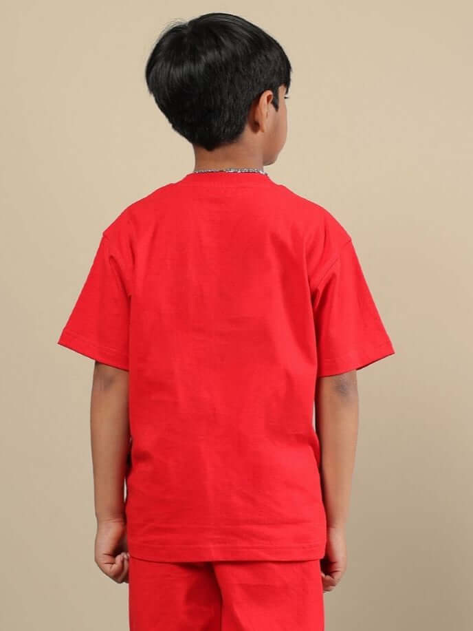 Child wearing ACE T-SHIRT FOR BOYS AND GIRLS RED from back view, showcasing bold color and comfortable fit.