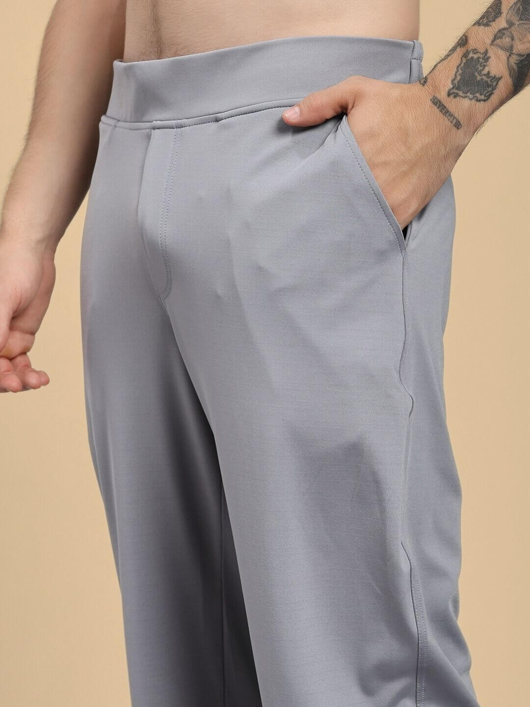 Close-up of person wearing ACTIVE FLEX RELAXED FIT JOGGER GREY demonstrating comfortable fit and flex-blend fabric.