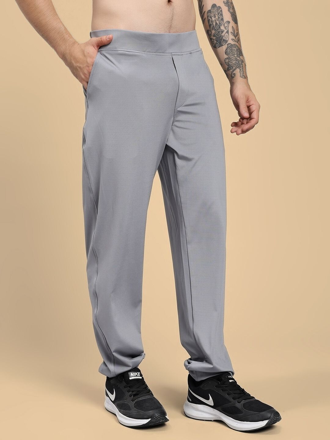 Model wearing ACTIVE FLEX RELAXED FIT JOGGER GREY, showcasing four-way stretch fabric and tapered ankle design for comfort and style.