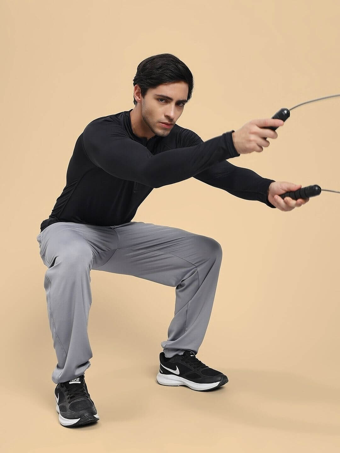 Man exercising in ACTIVE FLEX RELAXED FIT JOGGER GREY showcasing flexibility and comfort.
