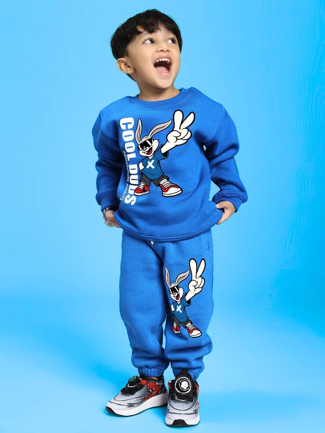 Child wearing Adventure Bunny Co-ord for Boys and Girls Blue, featuring cozy fleece sweatshirt and jogger set in vibrant blue.