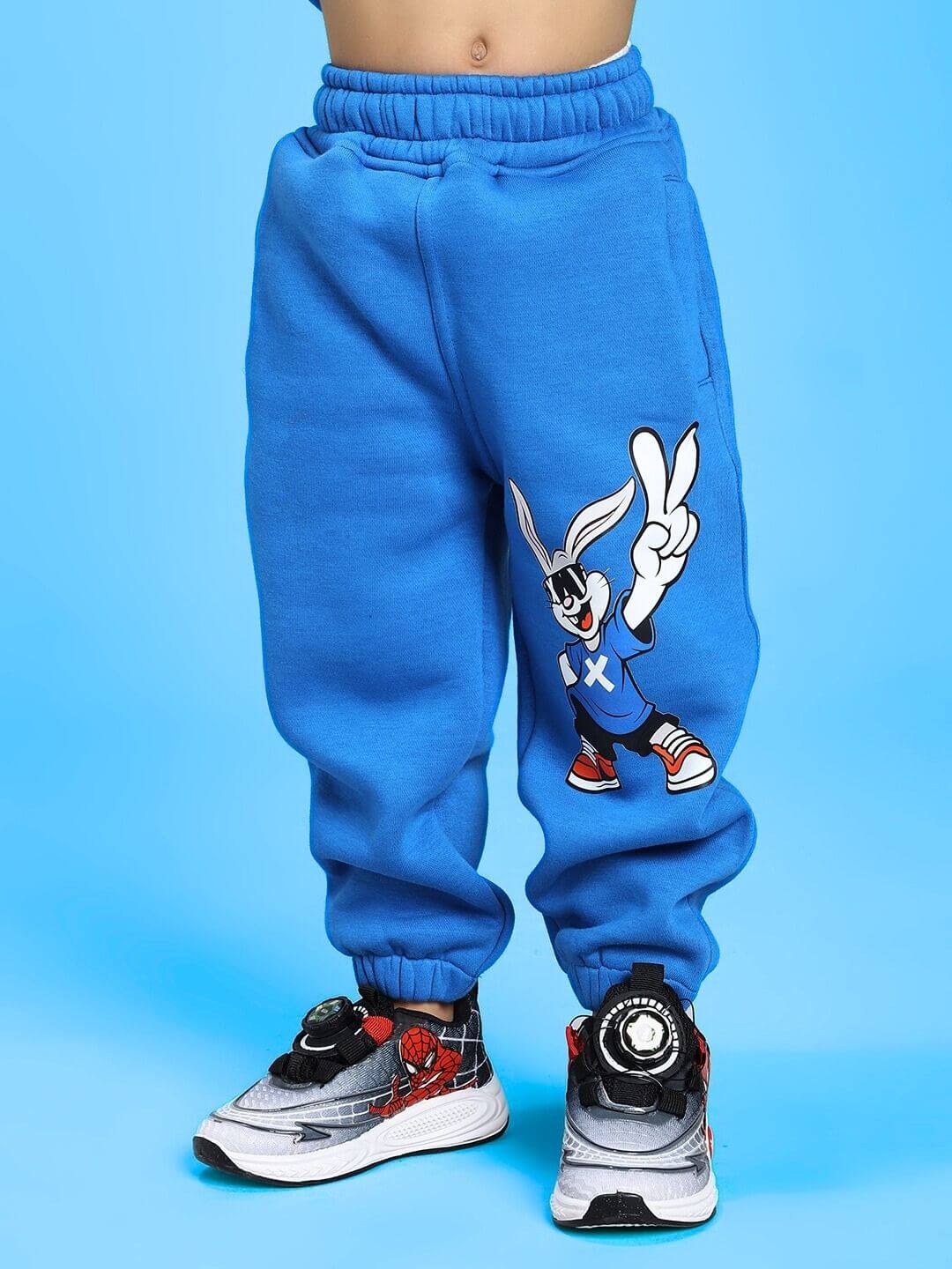 Child wearing Adventure Bunny Fleece Jogger for Boys and Girls Blue, featuring playful cartoon design.