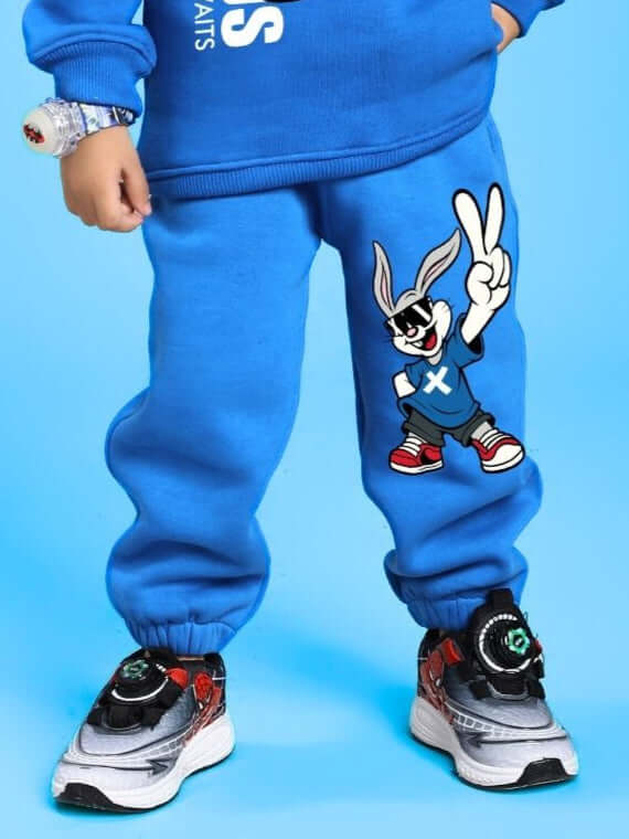 Child wearing Adventure Bunny Fleece Jogger for Boys and Girls Blue, featuring playful bunny design, showcasing comfort and style.