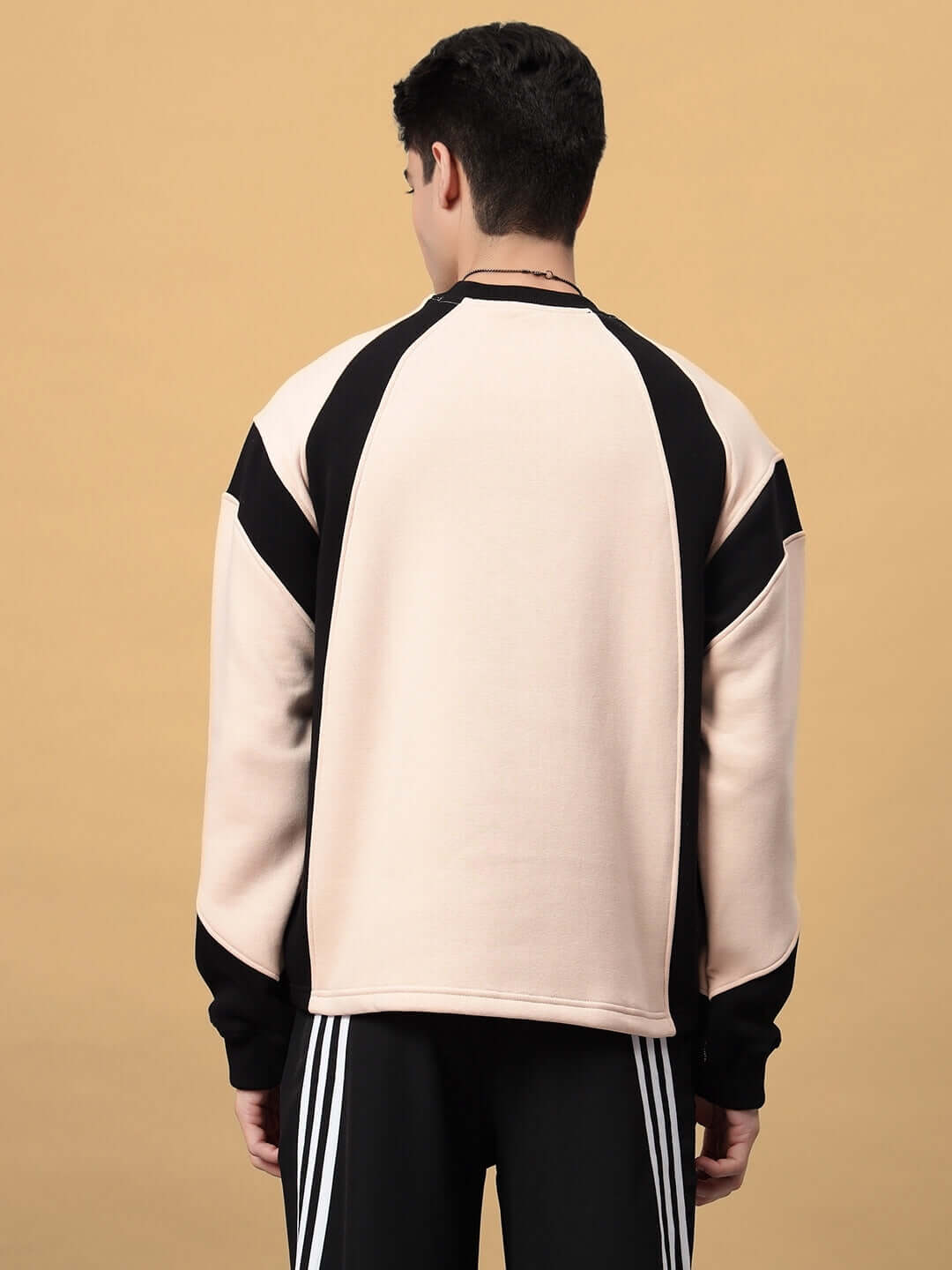 Back view of AERO OVERSIZED FLEECE SWEATSHIRT BEIGE, featuring soft warm fleece and relaxed silhouette for style and comfort.