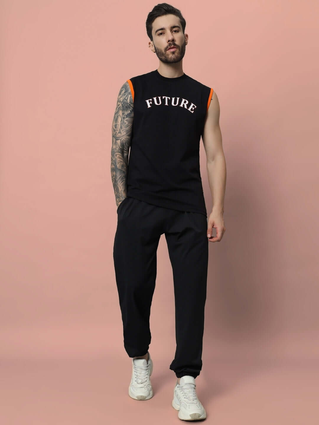 Model wearing black Agile Relaxed Pant Jogger by DUDS, customized fit available, styled for comfort and elegance. Made-to-order fashion.