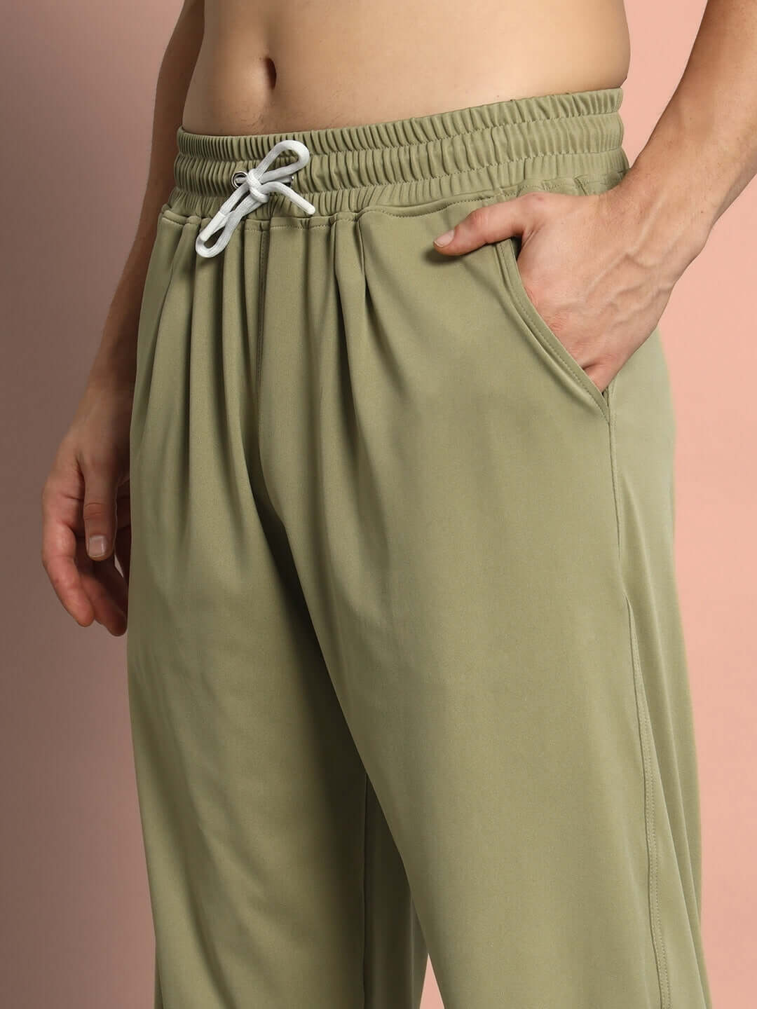 Model wearing olive green Agile Relaxed Pant Jogger with drawstring and pockets, highlighting comfort and style.