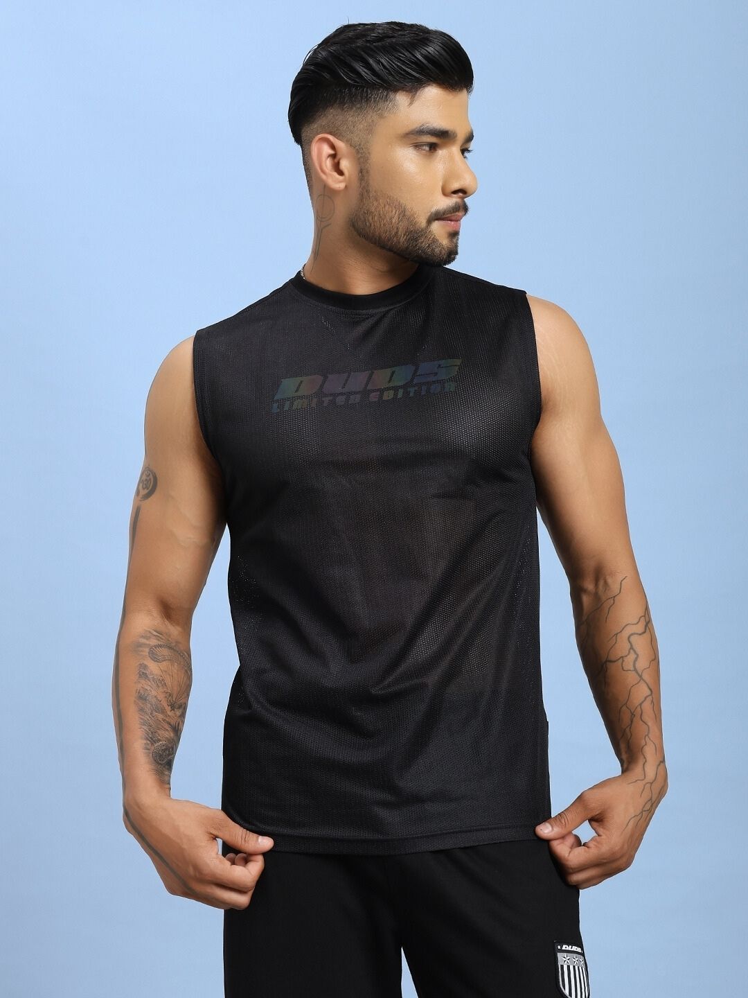 Man wearing AIR-FLOW REGULAR FIT T-SHIRT BLACK demonstrating comfort and breathability of the advanced Air-Flow fabric technology.