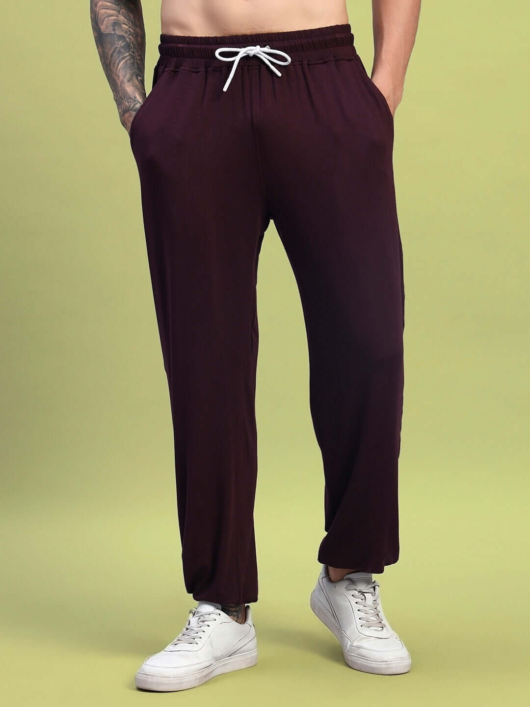 Maroon relaxed fit jogger pants from DUDS, featuring a comfortable drawstring waist, suitable for casual wear and sports activities.
