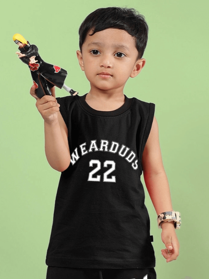 Child wearing black WEARDUDS t-shirt and holding an action figure, showcasing the AMIGA t-shirt style for boys and girls.