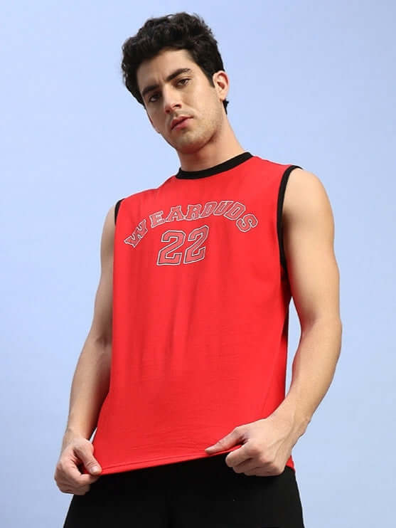 Model wearing AMIGA red gym t-shirt with custom fit option, featuring 'WEARDUDS' text and number 22, suitable for workouts.