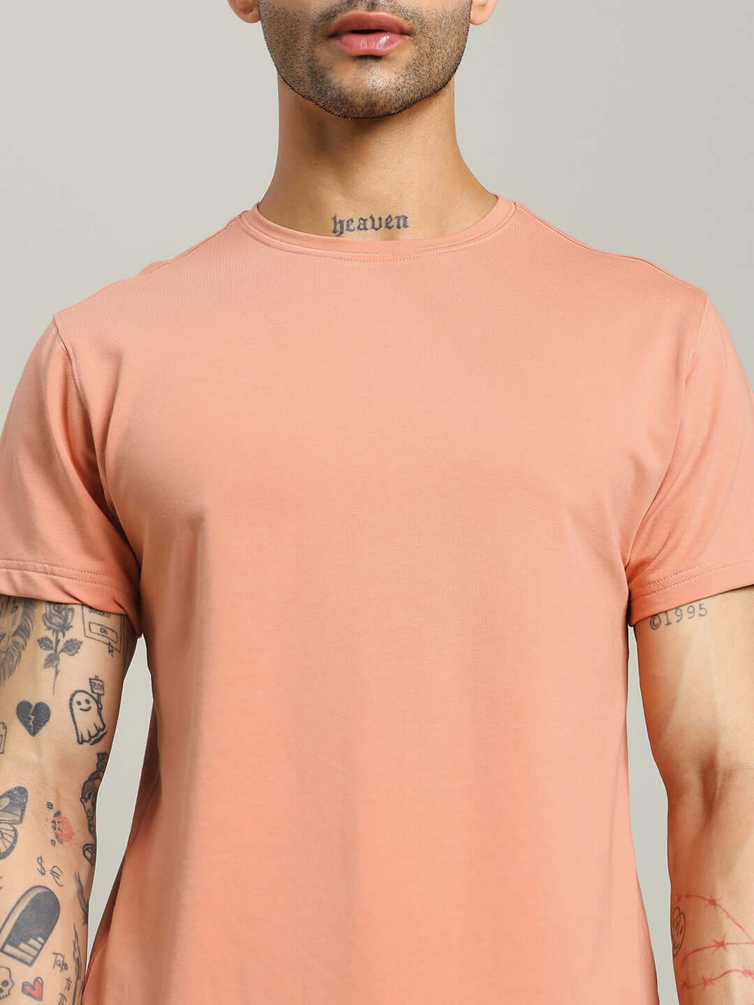 Peach Andrew Regular Fit T-Shirt in premium cotton, showcasing casual style with tattooed arm detail, ideal for fashion-forward looks.