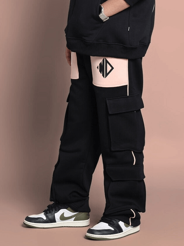 Child wearing ANGEL WINGS CO-ORD FOR BOYS & GIRLS BLACK BEIGE with sneakers, featuring black and beige streetwear design.