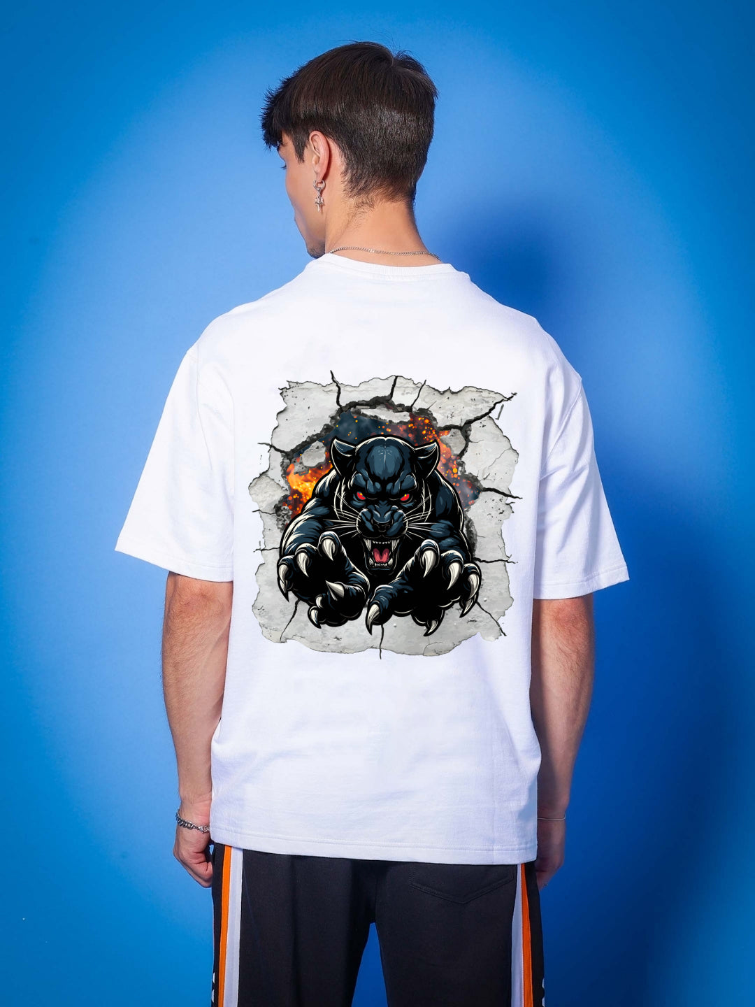 Man wearing ANGRY PANTHER OVERSIZED T-SHIRT WHITE with panther graphic on back